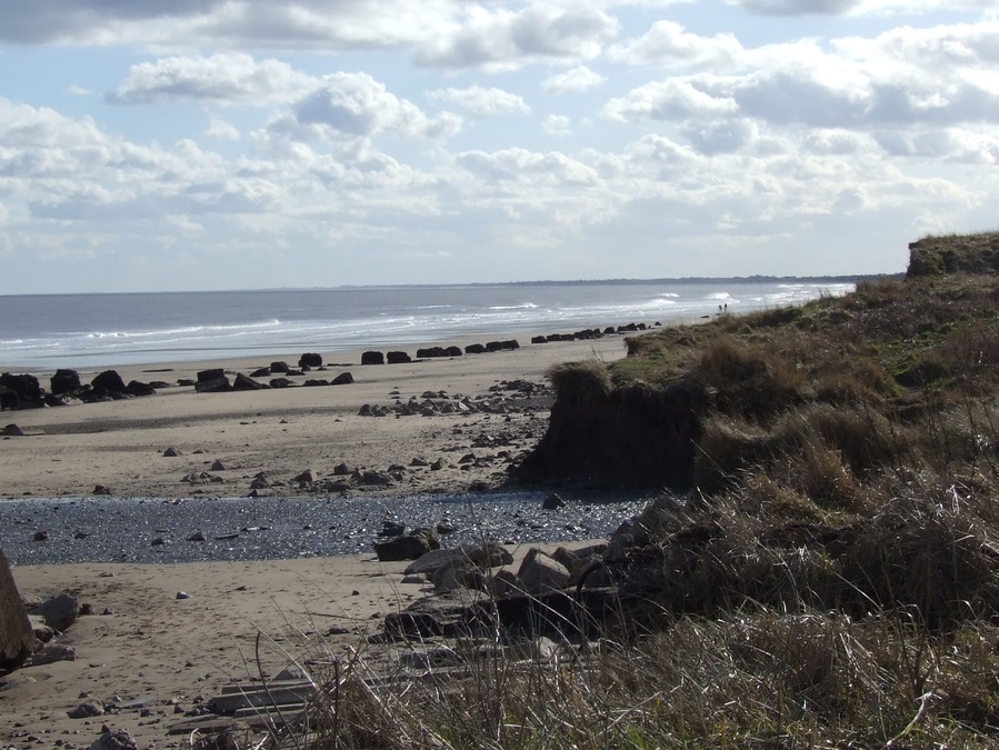 Fraisthorpe Beach, north east of Fraisthorpe, East Riding of Yorkshire, England. The blocks are concrete pillars which. were placed in the coast to keep the German tanks out of the UK during the Second Wold War.
