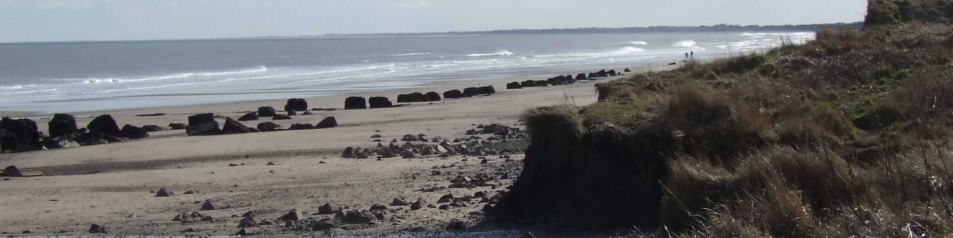 Fraisthorpe Beach, north east of Fraisthorpe, East Riding of Yorkshire, England. The blocks are concrete pillars which. were placed in the coast to keep the German tanks out of the UK during the Second Wold War.