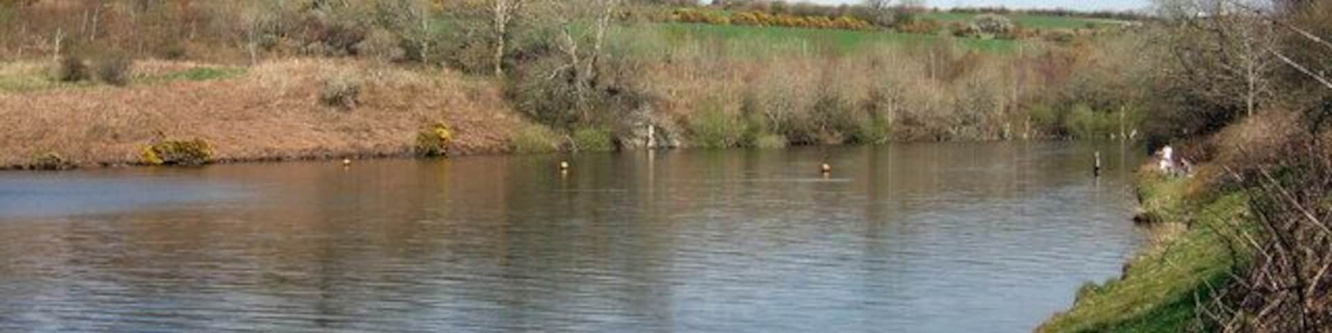 Eastern arm of reservoir The reservoir here fills an inlet created by a side-stream running down toward the main river valley. The floats indicate a no-go area for fishing and boating.