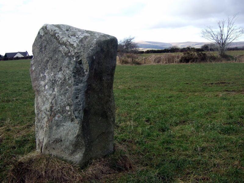 Standing stone and distant hills Looking in a northwesterly direction towards the village with the Preselis away to the north.