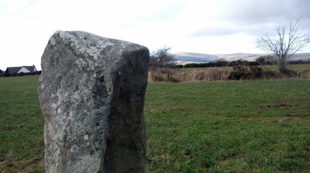 Standing stone and distant hills Looking in a northwesterly direction towards the village with the Preselis away to the north.
