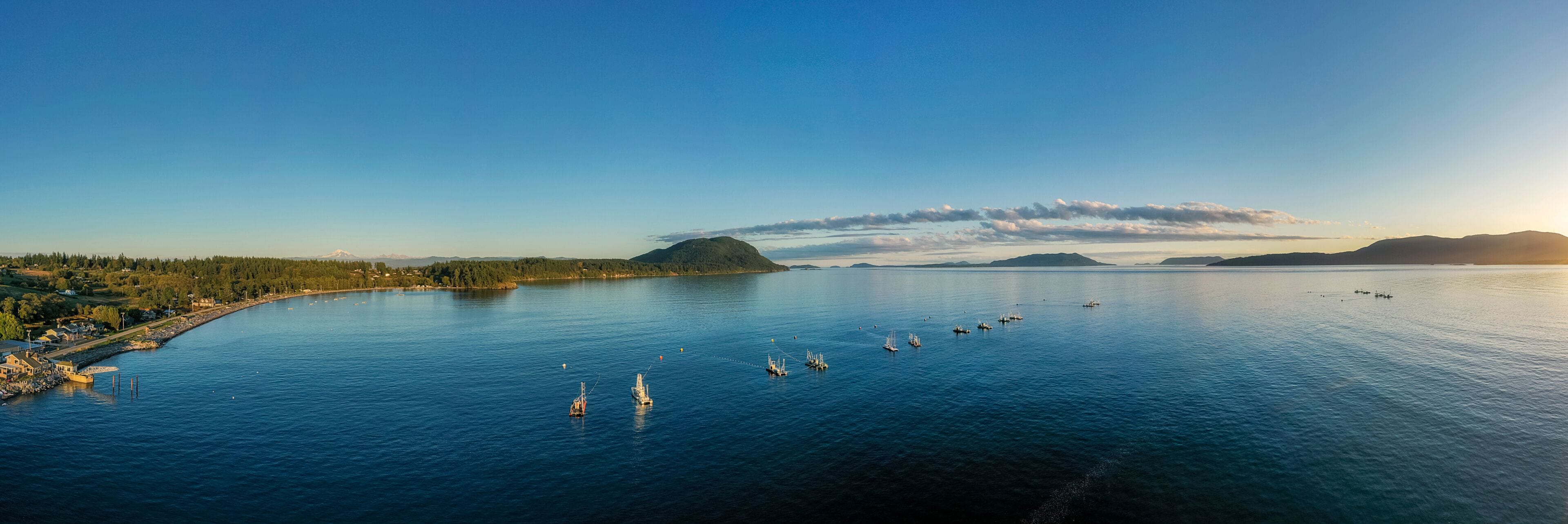 Reefnet Salmon Fishing Boats Off Lummi Island, Washington. Wild Pacific salmon reefnet fishing is an historical Pacific Northwest fishing method- the oldest known salmon net fishery in the world.