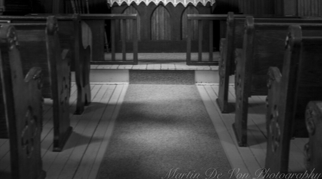 Lettered prominently on the steeple of the landmark Elbe Lutheran Church is "Ev. Luth. KIRCHE" (Evangelische Lutherische Kirche), a reminder of the founders' German origins.
This tiny (18-by-24 foot) church sits on its original location in the beautiful foothills west of Mount Rainier. The town of Elbe, Washington, has a rich German heritage and bears the name of the founders' origin, the Elbe River valley near Hamburg, Germany. As it has since 1906, the church signifies peace
and tranquility to residents and tourists alike.
Beginning in 1893, worshipers met in homes and the town hall until the church was constructed in 1906. A founder of the town, Heinrich Lutkens, donated the land and material for the church. Pastor Karl Kilian designed this simple yet pleasing building, and the townspeople built it themselves. Pastor Kilian served his Elbe flock from 1906 to 1933.
Forged by the town's first blacksmith, a 4-foot iron cross tops the 46-foot steeple, which houses the first bell. The church still features its original altar and elevated pulpit as well as one of the hand-carved pews. The original Farrand & Votey bellows organ is still used for worship and weddings. Offerings are taken with the traditional "Klingelbeutel" (a small red-velvet bag with a bell on it.)
Dr. Ervin E. Krebs conducted the research that led to the church's placement on the National Register of Historic Places in 1976.
Experience the simple charm of this tiny church where "time meets eternity." Worship services are held at 2:30 p.m. on the third Sunday of the month from March through November. Please join us if you are in the area. Open during the summer for tourists, the church is also a popular place for weddings.
Volunteers care for the Elbe Ev. Kirche, relying on
donations to maintain this historic church building.