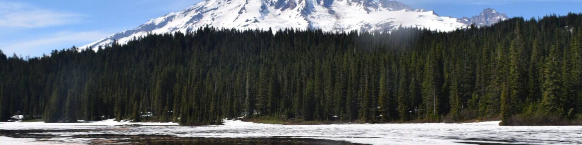 Snow covered Reflection Lake in the spring time. Pro Tip: Birkenstocks are not good snow shoes. #takeahike