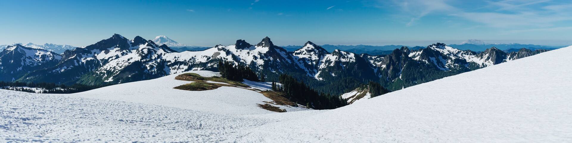 Washington mountain peaks with two volcanoes in the background