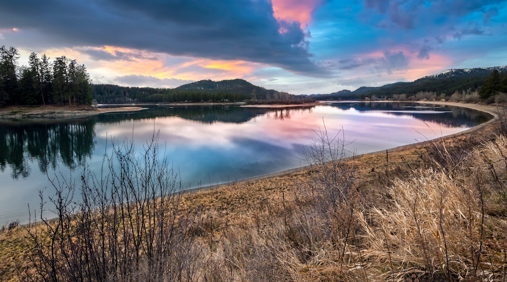 The Priest River seen under cloudy winter skies at sunset in the town of Newport, Washington USA.
