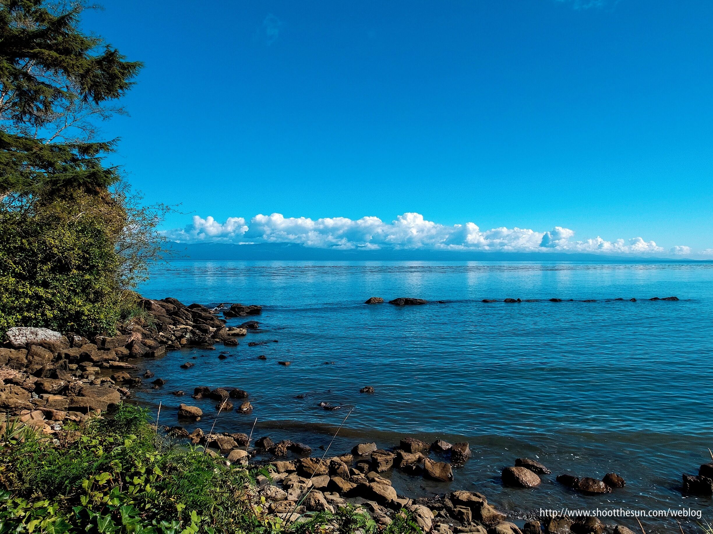 The clouds scudding across the top of Vancouver Island and the Strait of Juan De Fuca in between.