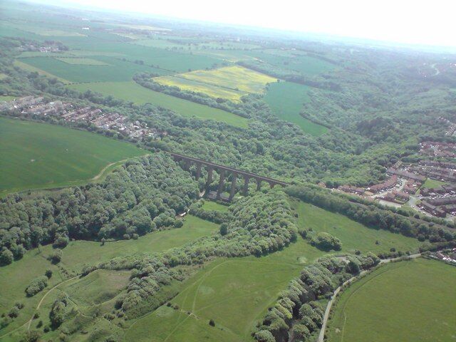 The railway viaduct at Castleden, Dene Mouth. This photograph was taken from 1200 feet above and a little to the east of the viaduct. To the left of the picture can be seen the northernmost buildings of the village of Blackhall colliery and to the right of the viaduct the southernmost buildings of Horden.
