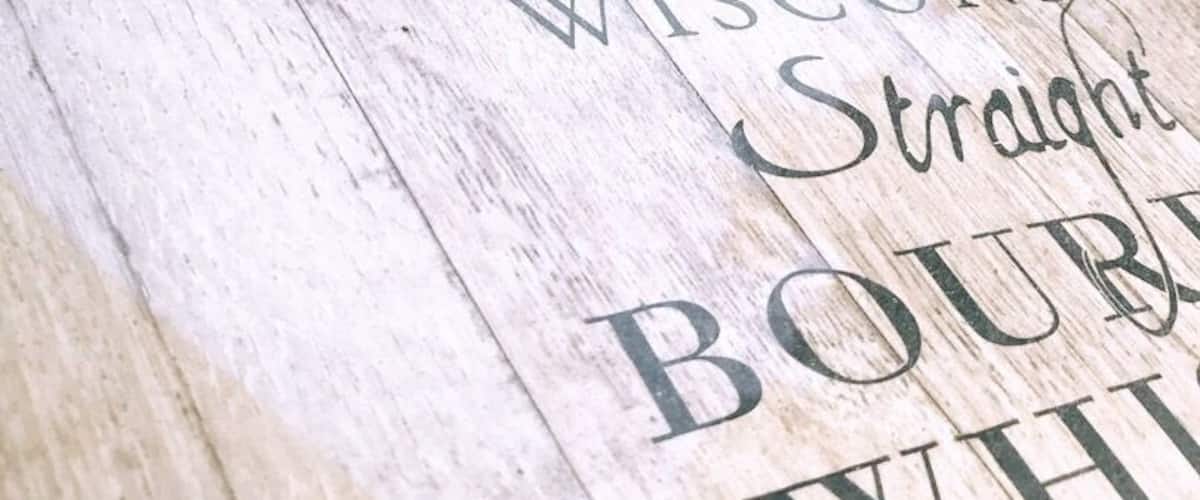 A wooden barrel with 'J. Lemery & Sons' and 'Wisconsin Straight Bourbon Whiskey' written on it.