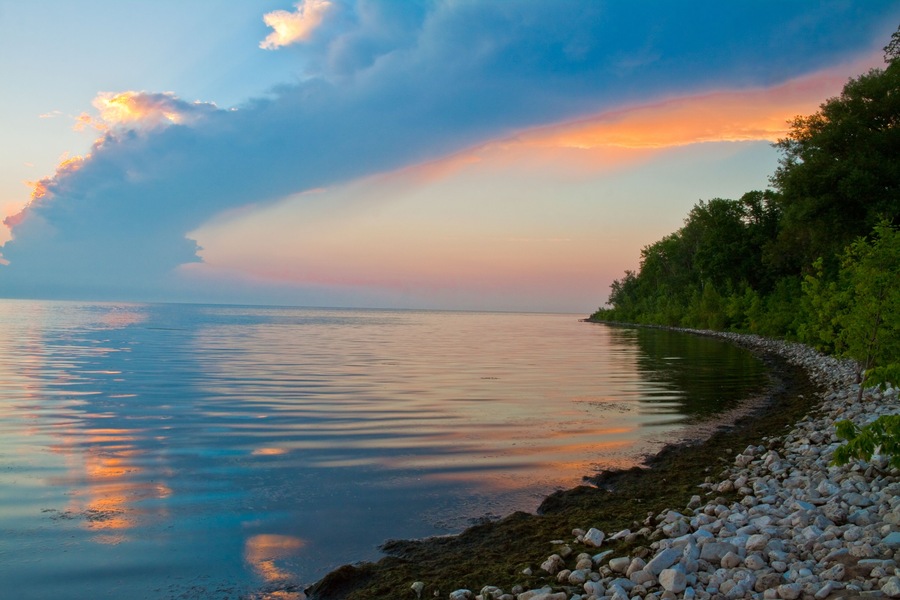 Sunset on Rocky Beach on Green Bay, Lake Michigan at Olde Rock Quarry County Park, Sturgeon Bay, Door County, Wisconsin, USA