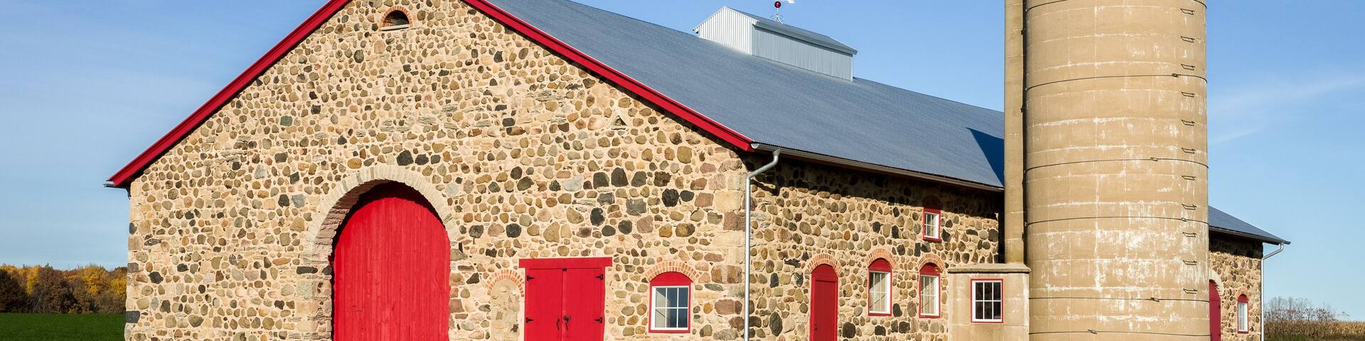 Retro Stone Barn with Bright Red Doors
