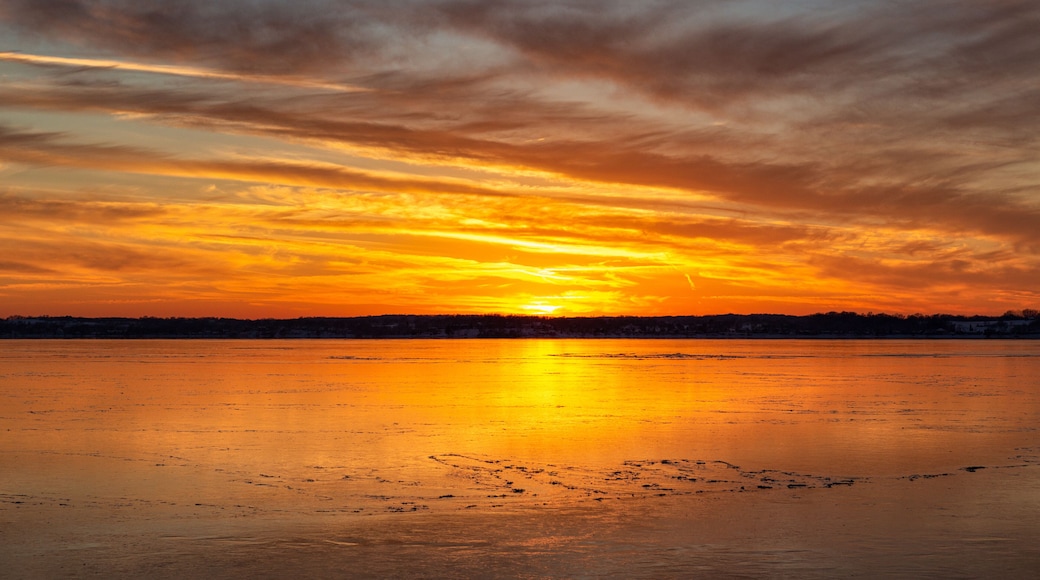 sunset over the ice on lake