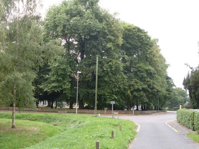 Impington, Cambridgeshire The entrance to Clay Close Lane with a glimpse of Impington Village College among the trees on the left.