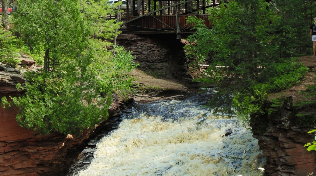 A wooden covered bridge is the focal point of this park