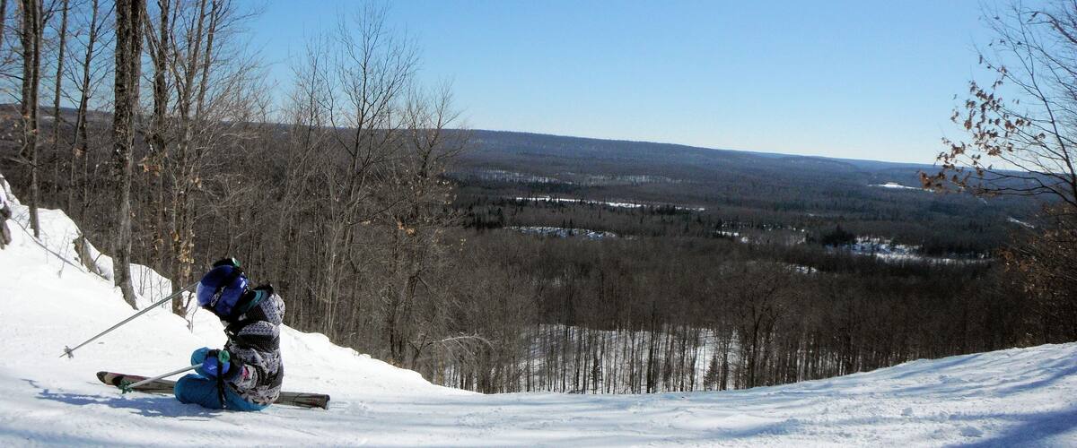A young skier takes a moment to build a little confidence.