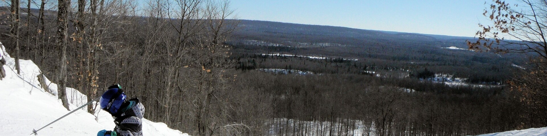 A young skier takes a moment to build a little confidence.