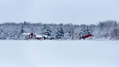Red house after a December snow storm in Wisconsin