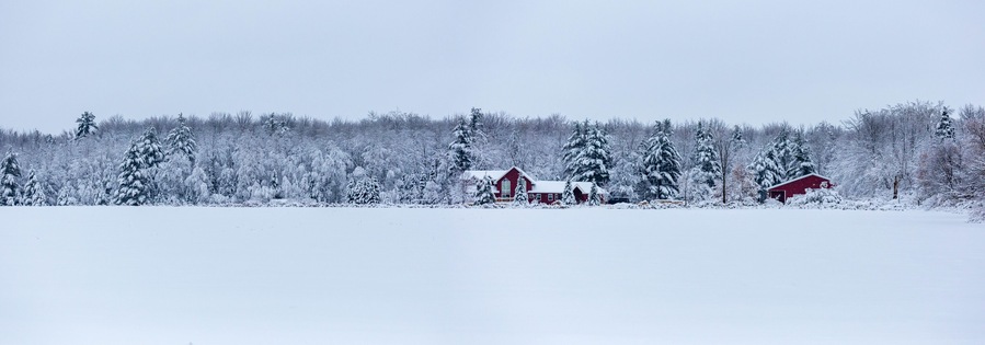 Red house after a December snow storm in Wisconsin