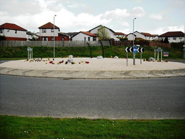 Roundabout on B799 Built at junction of link road to the new housing estates on south side of Chapelhall.