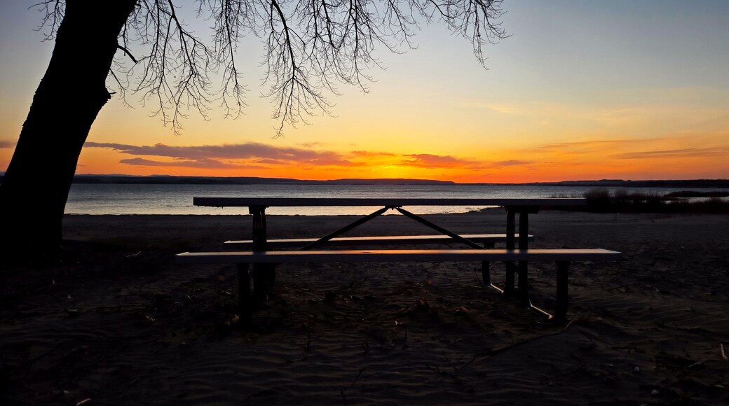 Reflection of sunset on picnic table