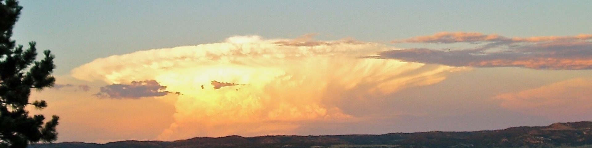 This was taken off of Highway 319, south of Glendo looking east over the valley. The Platte River runs on the east side of the valley. This cloud looks like a nuclear explosion in Nebraska:)