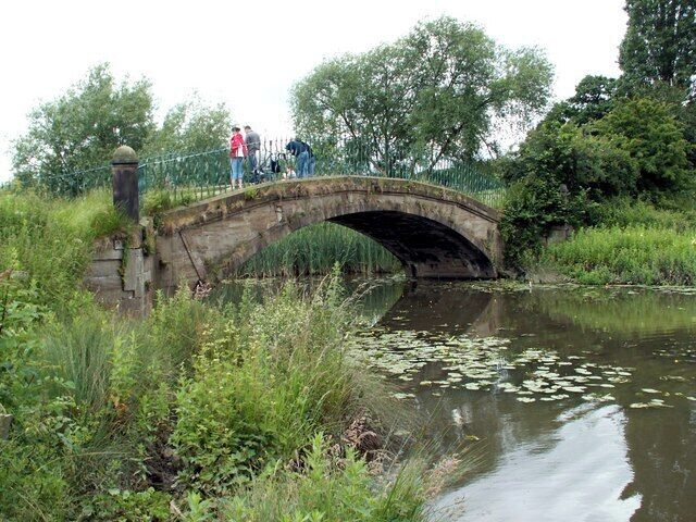 The bridge into Cannon Hall Country Park from Tivy Dale The bridge spans Cascade.