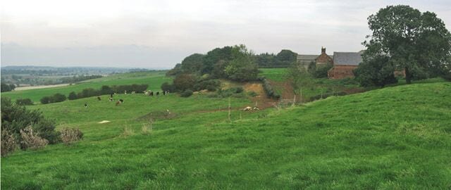 Top Farm, Green Lane, near Eaton. Top Farm sits at the top of Lings Hill (170m above sea level) overlooking the villages of Eaton and Branston. The ground falls away sharply to Bottom Farm (110m), at SK800 284. Looking east towards Croxton Kerial and Belvoir Castle.