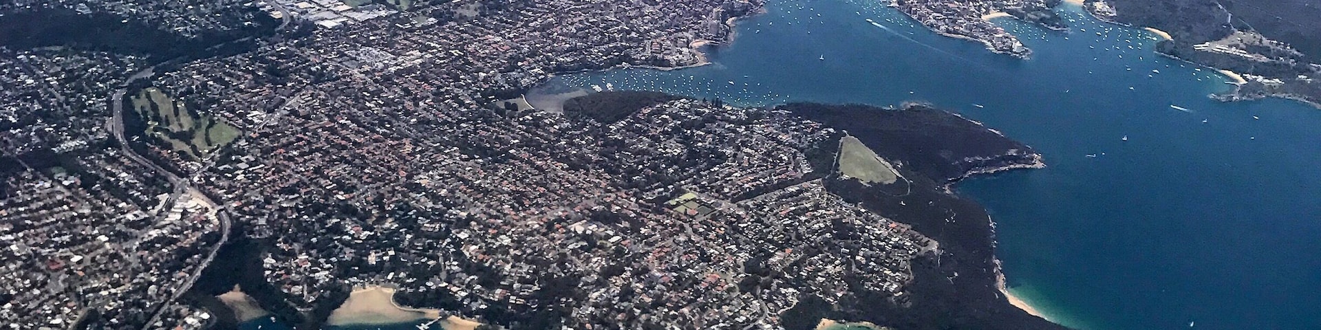 Flying into Sydney - The Spit & Chinamans & Balmoral Bch in the foreground. You can see the ferries going in&out of Manly - top. #sydney #aerialview #harbour #ferry #boats #wewhotravel #lifeatexpedia