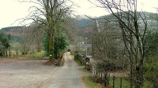 Track towards houses in Duror The building on the right is Duror Parish Church.