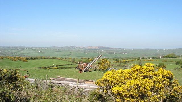 Old haymaking machinery at Clegir The photo underlines the pastoral nature of agriculture here in NE Anglesey, with silage/hay being the main crop. The mountain in the background in Mynydd Parys SH4490