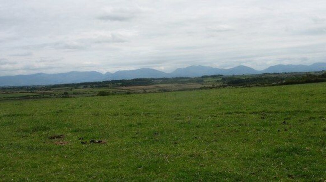 View south across farmlands from Bachau The northern flank of Snowdonia forms the background.