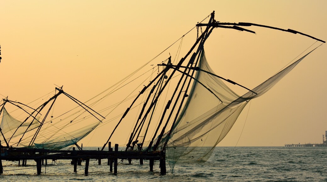 Stationary Chinese fishing nets (“Cheena vala” in Telugu) or shore operated lift nets at the sunset in Kochi Fort, Cochin, India