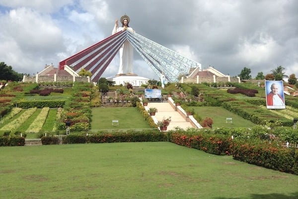This is the Divine Mercy Shrine in El Salvador City, Misamis Oriental, Philippines. It is a 9 hectare land and has a 50 ft statue of divine mercy Jesus. When you are in the bottom of the entrance, you will see many steps, which has a total of 200 steps up to the top that is also an overlooking of Macajalar Bay. First, before you proceed in steps, you have to borrow a long skirt in the counter to show respect to the Divine Mercy. When you reach the top, you will be given an orientation in what to do/not to do when you go the top of the Divine Mercy Statue. You can buy souvenirs and can get water from the sink on which you will pray first. This is such a wonderful place. â€ïž