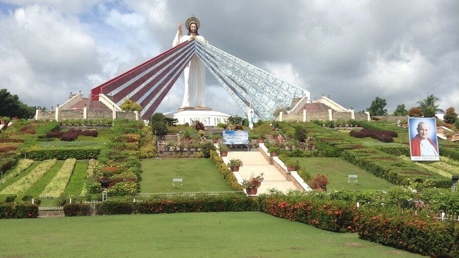 This is the Divine Mercy Shrine in El Salvador City, Misamis Oriental, Philippines. It is a 9 hectare land and has a 50 ft statue of divine mercy Jesus. When you are in the bottom of the entrance, you will see many steps, which has a total of 200 steps up to the top that is also an overlooking of Macajalar Bay. First, before you proceed in steps, you have to borrow a long skirt in the counter to show respect to the Divine Mercy. When you reach the top, you will be given an orientation in what to do/not to do when you go the top of the Divine Mercy Statue. You can buy souvenirs and can get water from the sink on which you will pray first. This is such a wonderful place. ❤️