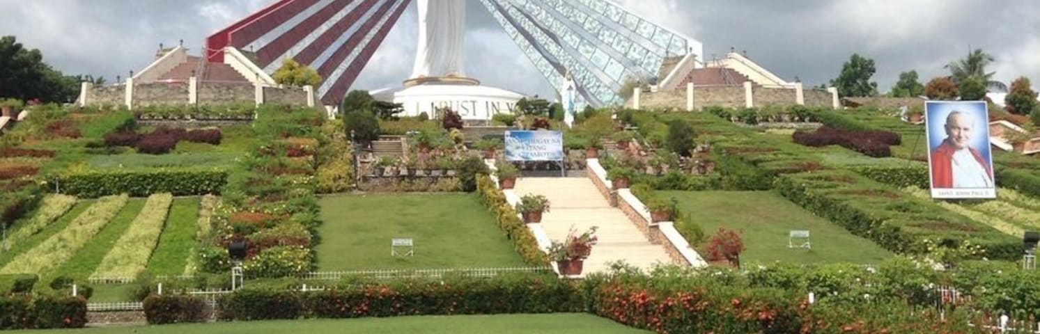 This is the Divine Mercy Shrine in El Salvador City, Misamis Oriental, Philippines. It is a 9 hectare land and  has a 50 ft statue of divine mercy Jesus. When you are in the bottom of the entrance, you will see many steps, which has a total of 200 steps up to the top that is also an overlooking of Macajalar Bay. First, before you proceed in steps, you have to borrow a long skirt in the counter to show respect to the Divine Mercy. When you reach the top, you will be given an orientation in what to do/not to do when you go the top of the Divine Mercy Statue. You can buy souvenirs and can get water from the sink on which you will pray first. This is such a wonderful place. ❤️