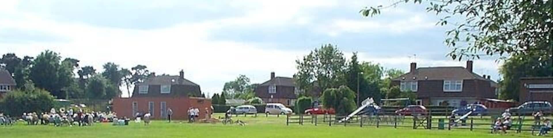 Recreation Ground, w:Stanley Common. A public open space by the side of the main road used by the local community. In winter local football teams play here but in summer it is the occasional venue for open air brass band concerts as can be seen here. w:South Derbyshire