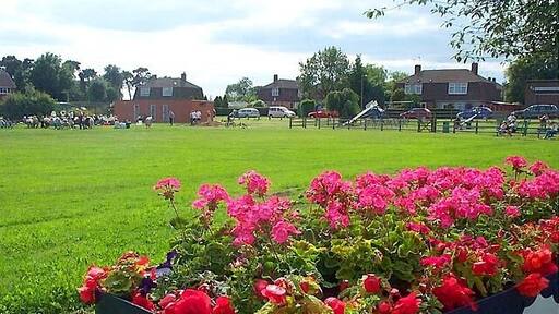 Recreation Ground, w:Stanley Common. A public open space by the side of the main road used by the local community. In winter local football teams play here but in summer it is the occasional venue for open air brass band concerts as can be seen here. w:South Derbyshire