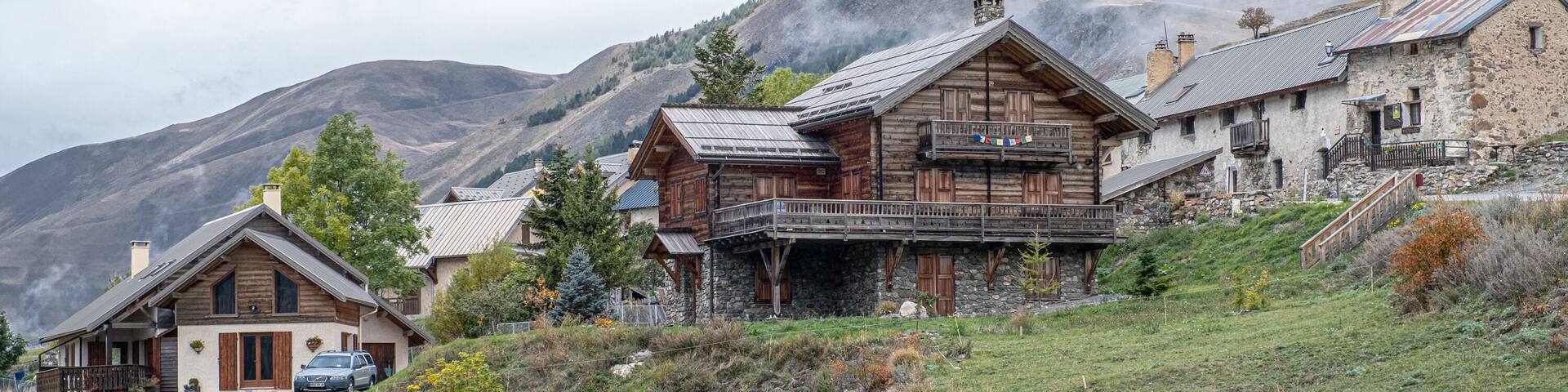 View of the small village of Les Cours, above Lac du Pontet, near Villar d'Arene and Col du Lautaret, Hautes-Alpes, France