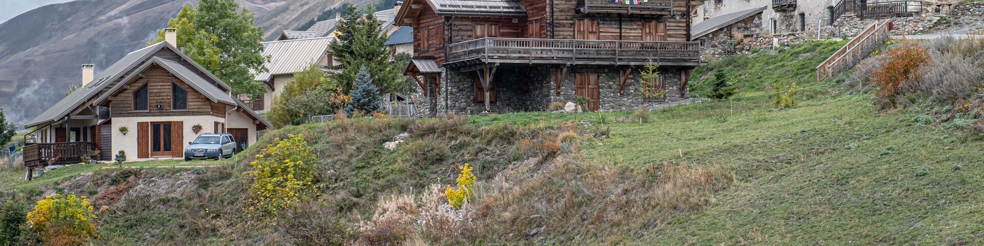 View of the small village of Les Cours, above Lac du Pontet, near Villar d'Arene and Col du Lautaret, Hautes-Alpes, France