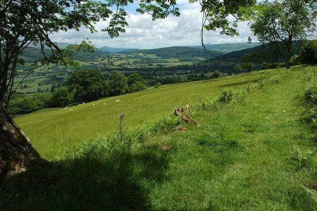 The Usk valley View down the Usk valley from the Usk Valley Walk above Talybont-on-Usk. The wooded Buckland Hill can be seen in the centre of the valley with the distinctive Sugar Loaf on the horizon.