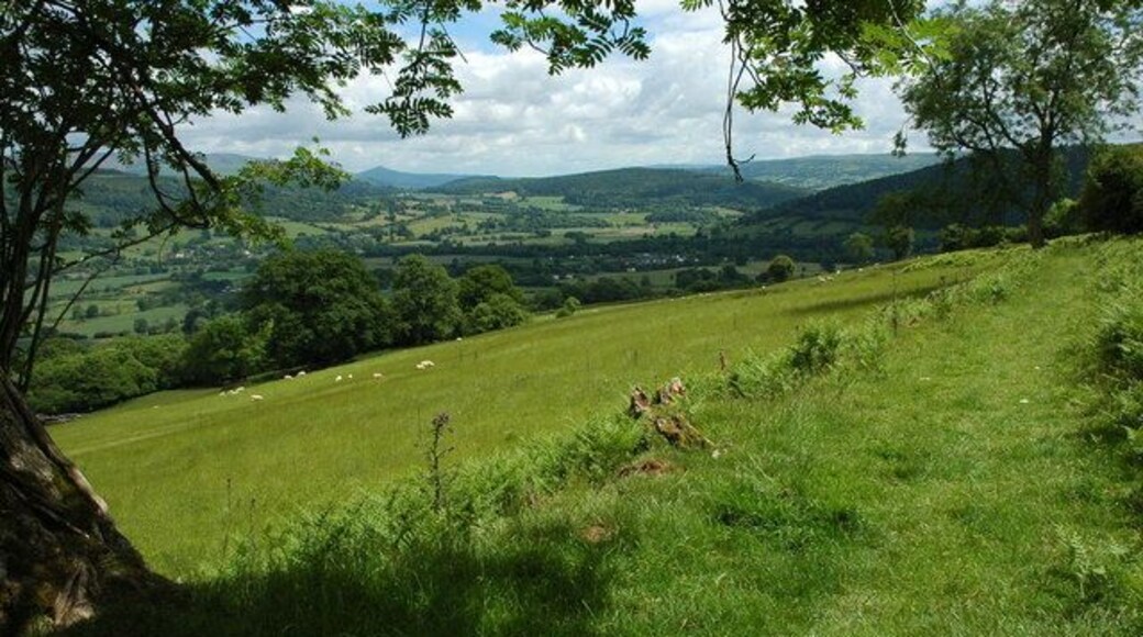 The Usk valley View down the Usk valley from the Usk Valley Walk above Talybont-on-Usk. The wooded Buckland Hill can be seen in the centre of the valley with the distinctive Sugar Loaf on the horizon.