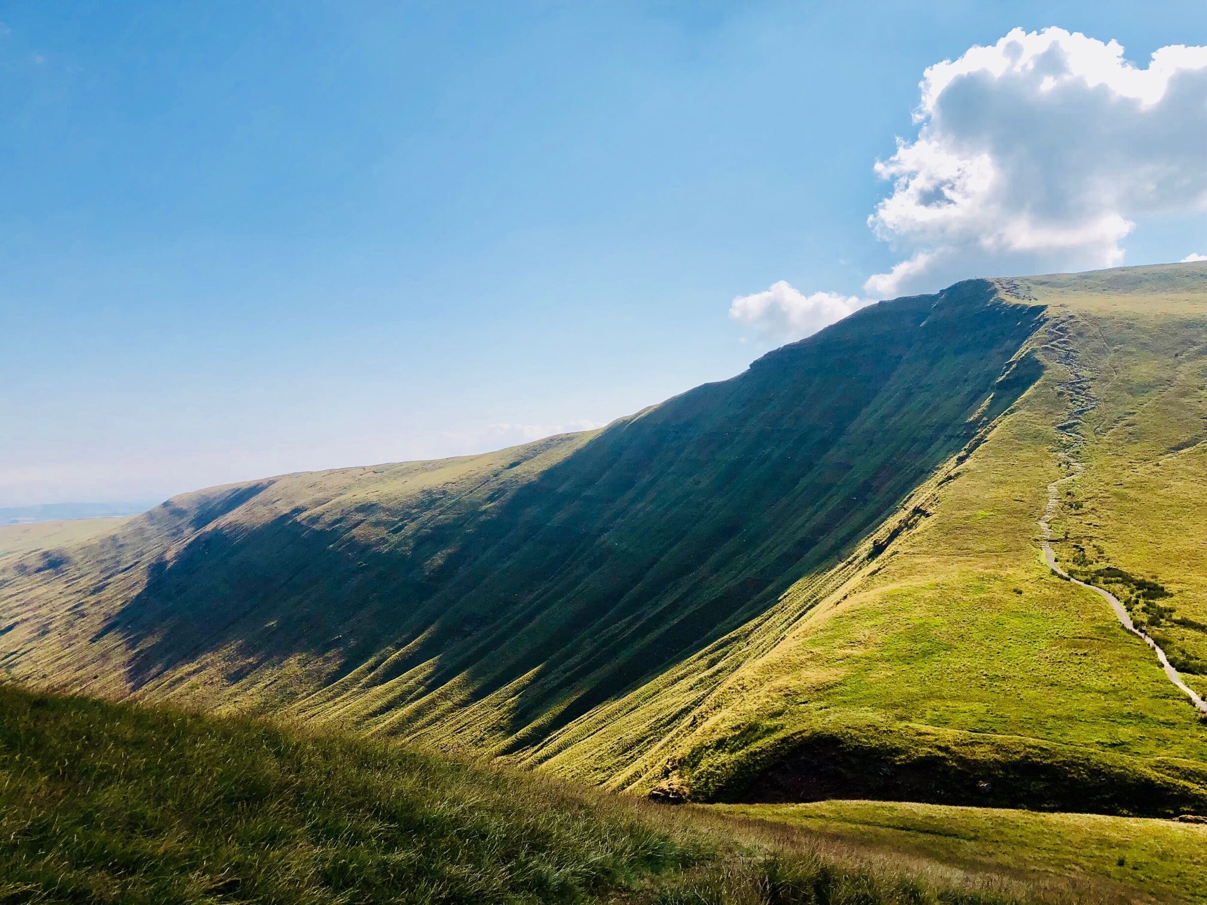 A mountain landscape with a winding path.