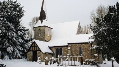 Parish church of SS Peter and Paul, Chaldon, Surrey, seen from the southeast in snow