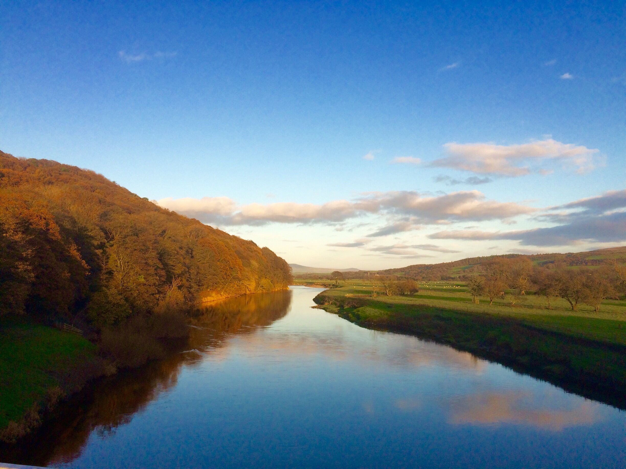 The River Lune at Caton. Aughton Woods on the northern river bank is a peaceful place for a walk. Come in the spring to see a beautiful display of bluebells. 