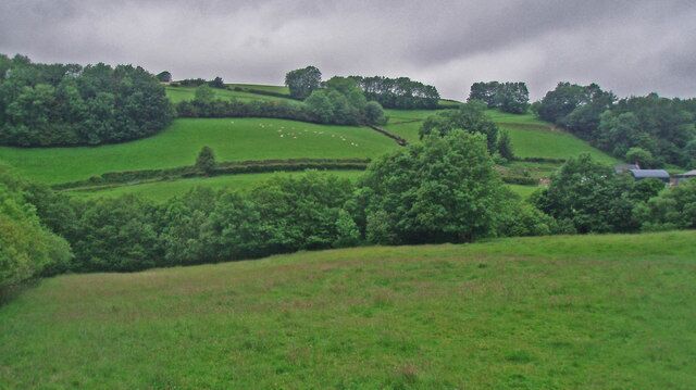 Sloping fields and small woodlands