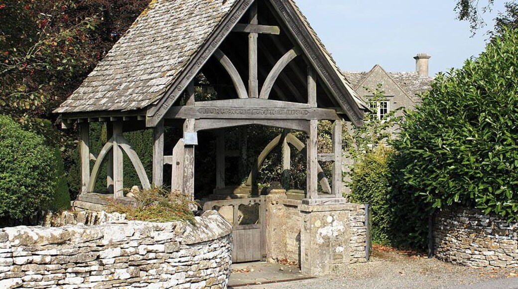 Lychgate, St Andrew's Church, Miserden According to the inscription, this lychgate was given in memory of Maria, the wife of the Rev. W Yarnton Mills, rector of Miserden from 1842 to 1870. It was built in 1900. The old rectory is just visible behind the lychgate.
