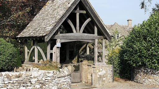 Lychgate, St Andrew's Church, Miserden According to the inscription, this lychgate was given in memory of Maria, the wife of the Rev. W Yarnton Mills, rector of Miserden from 1842 to 1870. It was built in 1900. The old rectory is just visible behind the lychgate.