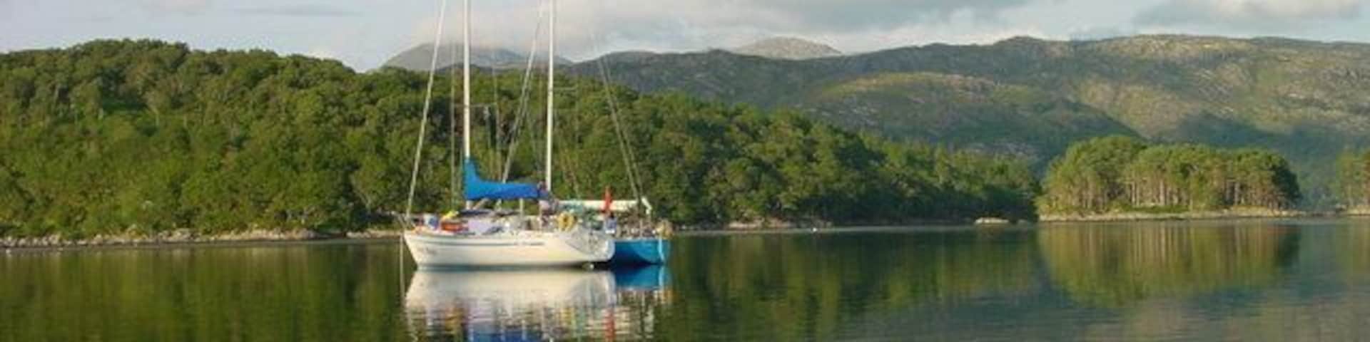 Dropping Anchor off Shona. Dropping anchor for the evening in the South Channel off Eilean Shona with Shona Beag in the background