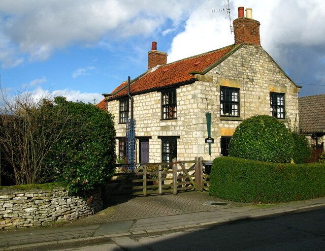 Sawpit Cottage at Slingsby The name and blade on the wall give a hint to the past.