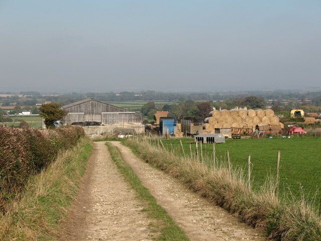 Farm buildings at Slingsby. From the bridleway that heads southwards on to the Howardian Hills, looking north towards the Vale of Pickering.